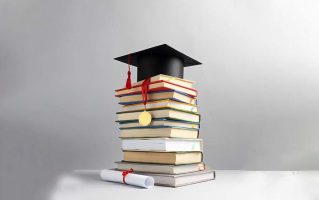 front-view-stacked-books-graduation-cap-diploma-education-day